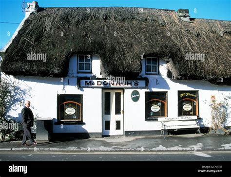 oranmore, county galway, ireland, old traditional thatched roofed pub bar shop, in rural ireland ...