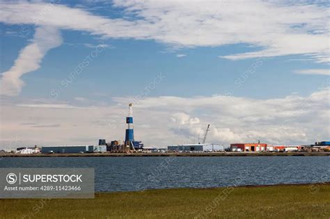 Oil drilling rig along Lake Colleen in Deadhorse, Prudhoe Bay Oil Field, Arctic Alaska, Summer ...