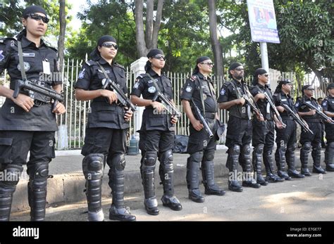 Dhaka, Bangladesh. 17th Sep, 2014. Members of Rapid Action Battalion (Rab) stand guard in front ...