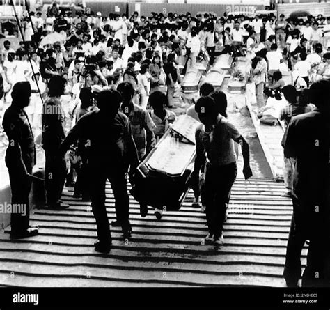 Relatives load some 98 coffins of victims of the century's worst sea ...