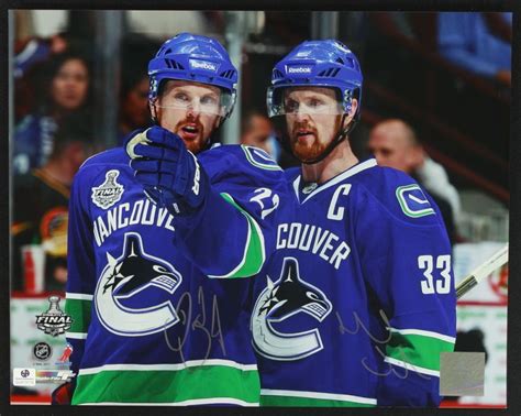 Daniel Sedin & Henrik Sedin Signed Canucks 11x14 Photo (GA COA)