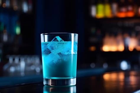 Premium AI Image | A blue cocktail with ice cubes on a bar counter.