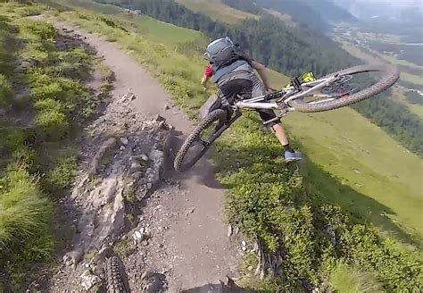 Watch: Bike plummets off the side of a mountain following minor crash ...