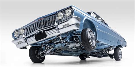 custom lowrider 1964 chevrolet impala convertible tilts and pumps over three wheels