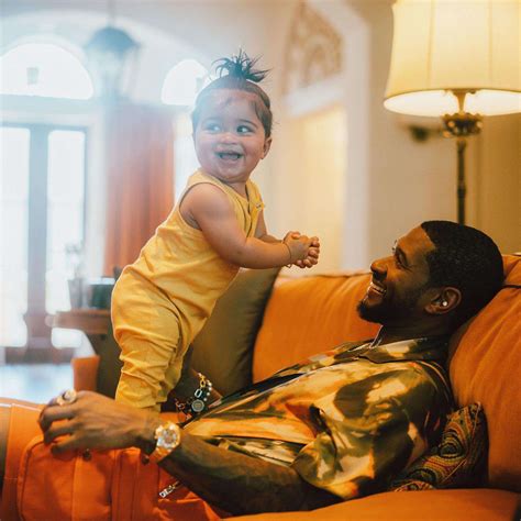 Usher Shares Adorable Photos Hanging Out with Baby Boy Sire