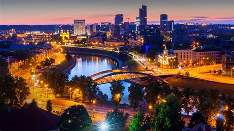 Cityscape view of New Center of Vilnius with Neris river from Gediminas Tower at night ...