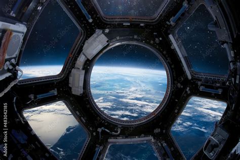 Fotka „Earth planet in the ISS porthole. View from Cupole ...