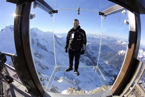 Step into the Void's glass cage hangs over the edge of mountain in ...