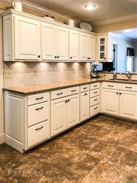 Painting these oak cabinets brightened up the is kitchen ...