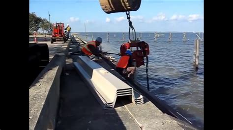 Vibro Hammer Installation ShoreGuard® Vinyl Sheet Piling Seawall by CMI - YouTube