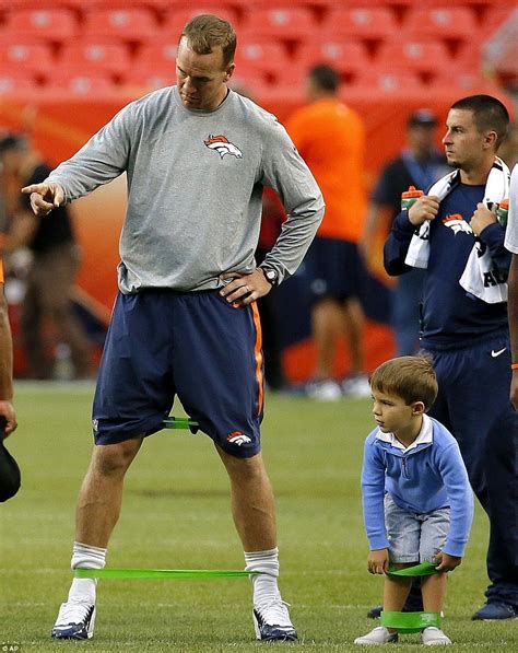 Learning from the master: Manning gave some instruction to his son before the Broncos 22-20 loss ...