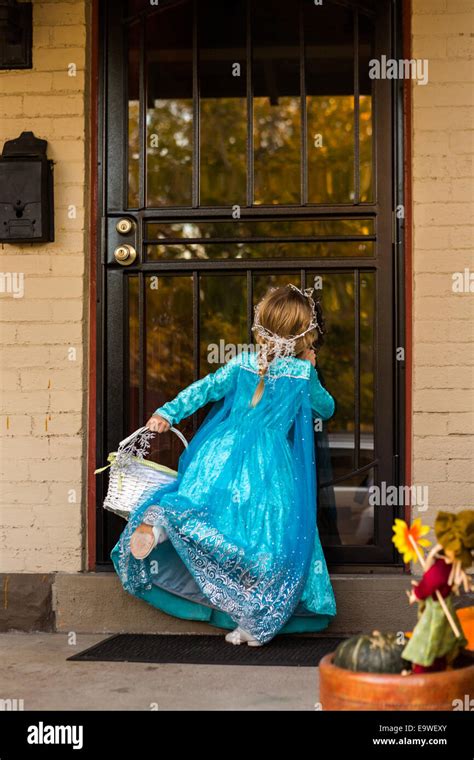 Trick or treating in costumes on Halloween night Stock Photo - Alamy