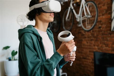 Man playing video game in VR headset with controllers · Free Stock Photo