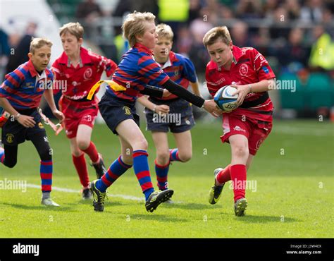 Teams of children playing tag rugby Stock Photo - Alamy