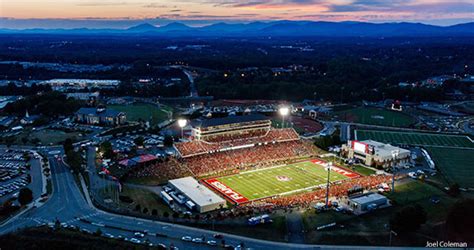 Record crowd at Williams Stadium cheers Flames to gridiron victory ...