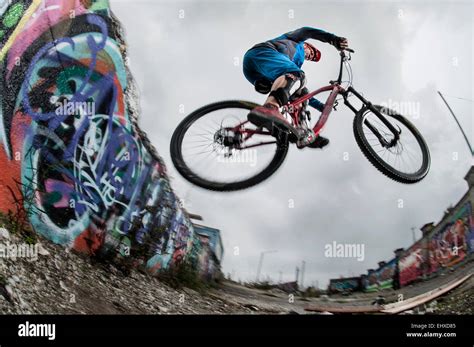 Mountain biker stunts on road, Bavaria, Germany Stock Photo - Alamy