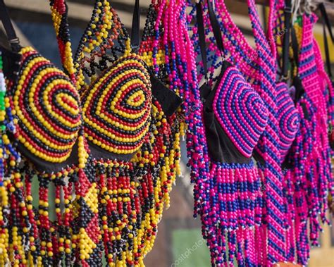 Traditional African colorful handmade beads clothes. Folk art. African market. Ethnic fashion ...