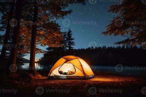 camping tent near trees during night time 28289860 Stock Photo at Vecteezy