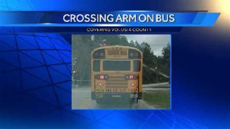 Railroad crossing arm comes down on school bus near DeLand