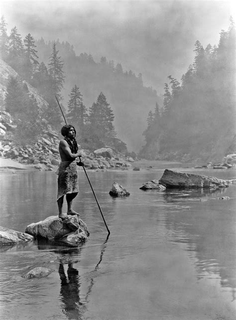 A Smoky Day at the Sugar Bowl: A fisherman of the Hupa tribe of California looks out over a lake ...