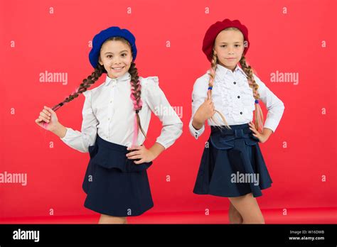 happy children in uniform. little girls in french beret. Education ...