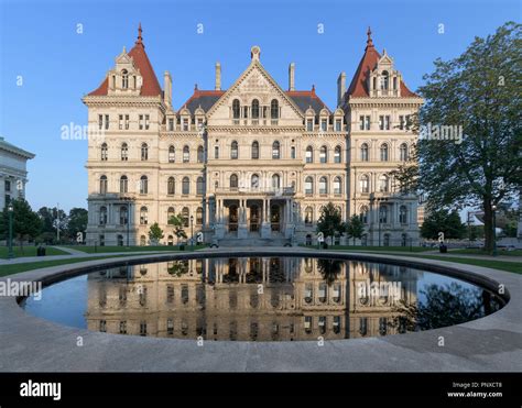 New York State Capitol building and its reflection from West Capitol Park in Albany, New York ...