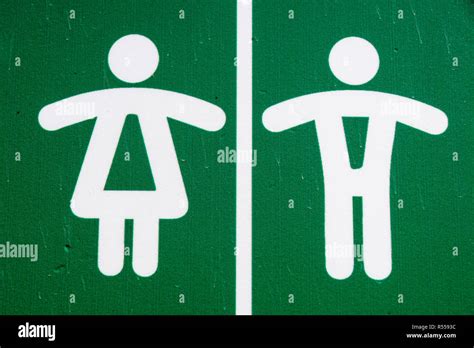 Public restroom toilet WC sign man and woman in green Stock Photo - Alamy