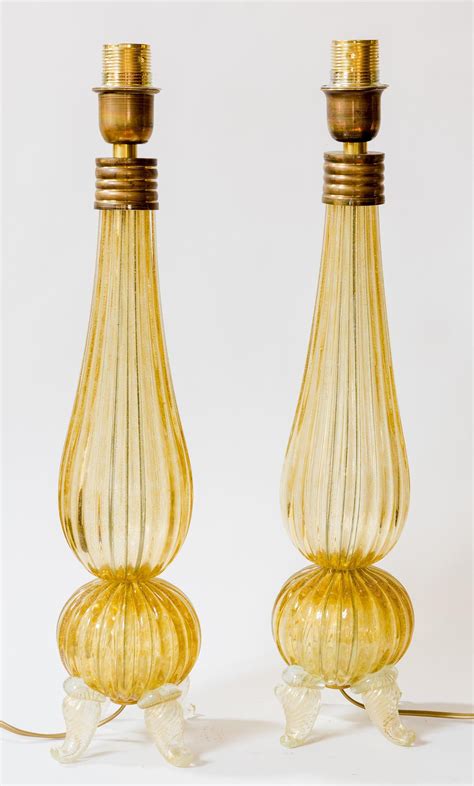 A PAIR OF AMBER MURANO GLASS LAMP BASES CIRCA 1950, 60cm high Estimate $1,200-1,500 | Glass lamp ...