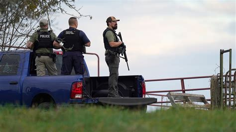 Heavily armed police surround home in search for suspect in the fatal shooting of 18 in Maine