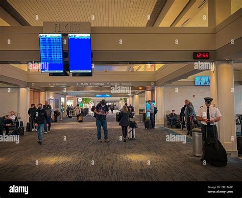 Travelers in the terminal at General Mitchell International Airport in Milwaukee, Wisconsin ...