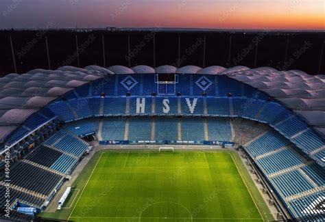 Aerial night view over the illuminated Volksparkstadion, home stadium of football club Hamburger ...