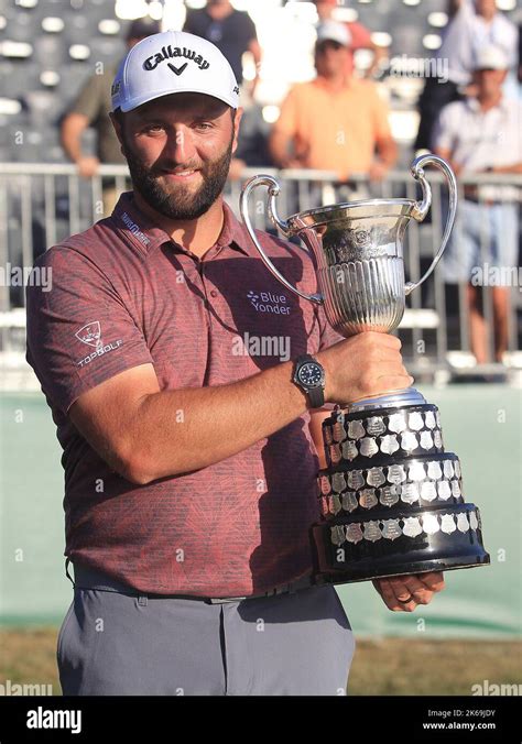 Spanish player Jon Rahm lifts the trophy at the prize giving ceremony ...