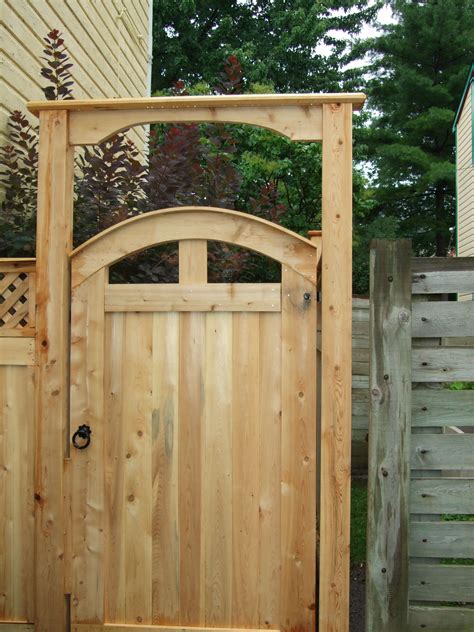 Lovely arched pre made cedar gate with matching gate brace. Supplied ...