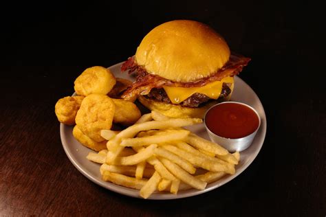 Burger and French Fries Served in a Restaurant · Free Stock Photo