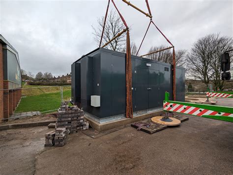 The first "Net Zero Pod" is craned into place at Biddulph Valley ...