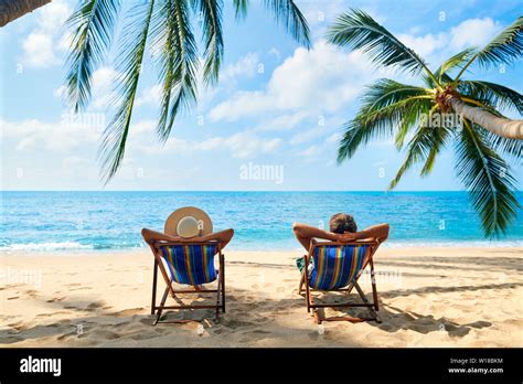 Couple relax on the beach enjoy beautiful sea on the tropical island ...