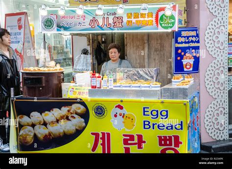 A lady mans her street food stall in Myeongdong in Seoul, South Korea Stock Photo - Alamy