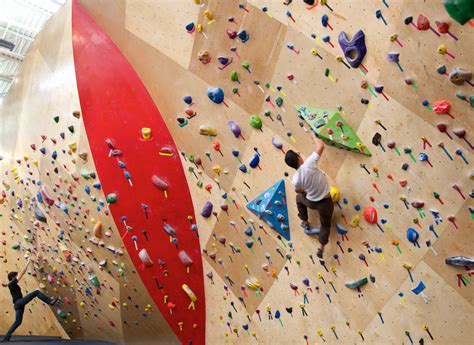 brooklyn boulders coworking space features towering rock climbing wall