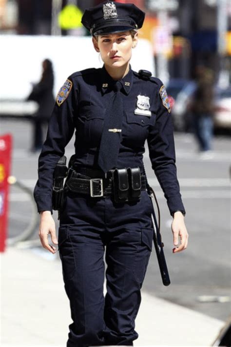 Female Police Officer Walking Down the Street