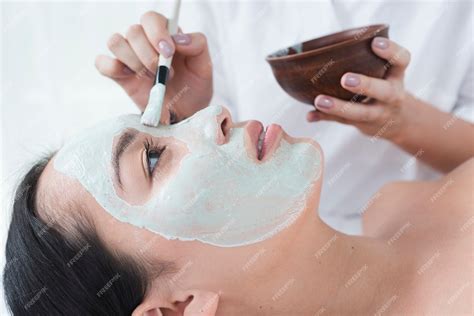 Premium Photo | Woman with a facial mask in a spa