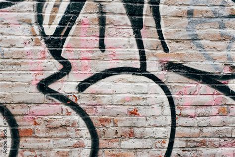 Graffiti markings on old brick wall Stock Photo | Adobe Stock