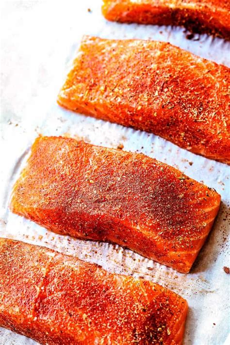 showing how to make Blackened Salmon by seasoning with blackened seasoning | Salmon recipe pan ...