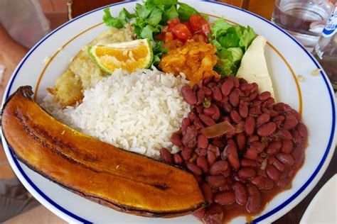 Check out this Costa Rican dish called casado. Rice, beans, plantains, salad and fish. Casado ...