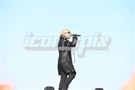 Photo of Disturbed performing in 2023. | IconicPix Music Archive