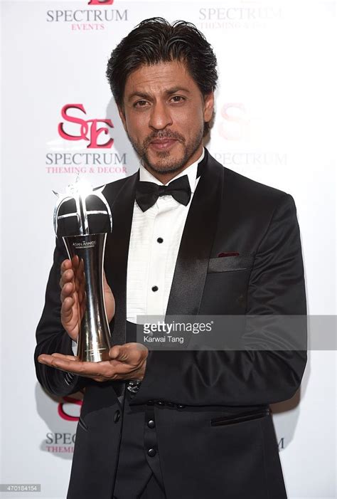 Shah Rukh Khan with his award for Outstanding Achievement in Cinema during The Asian Awards 2015 ...