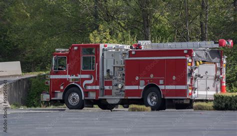 Fire pumper truck at intersection Stock Photo | Adobe Stock