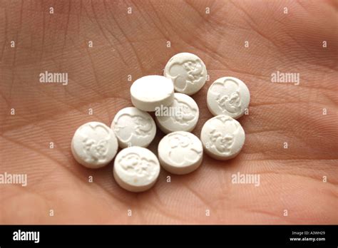 E Ecstasy pills or tablets close up studio shot Showing white pills in ...