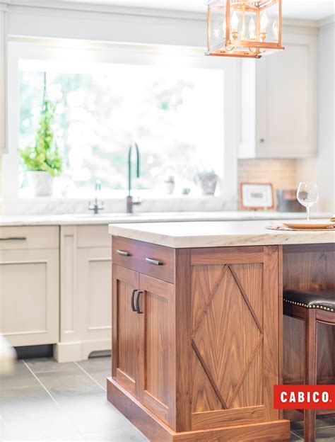 This Natural Walnut Island adds a rich warmth to this white kitchen. The Diamond Overlay pattern ...