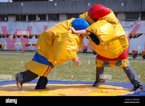 Funny sumo fighting parody in special costumes Stock Photo - Alamy