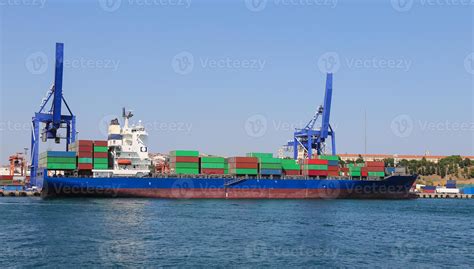 Container Ship is loading in a port 10293033 Stock Photo at Vecteezy